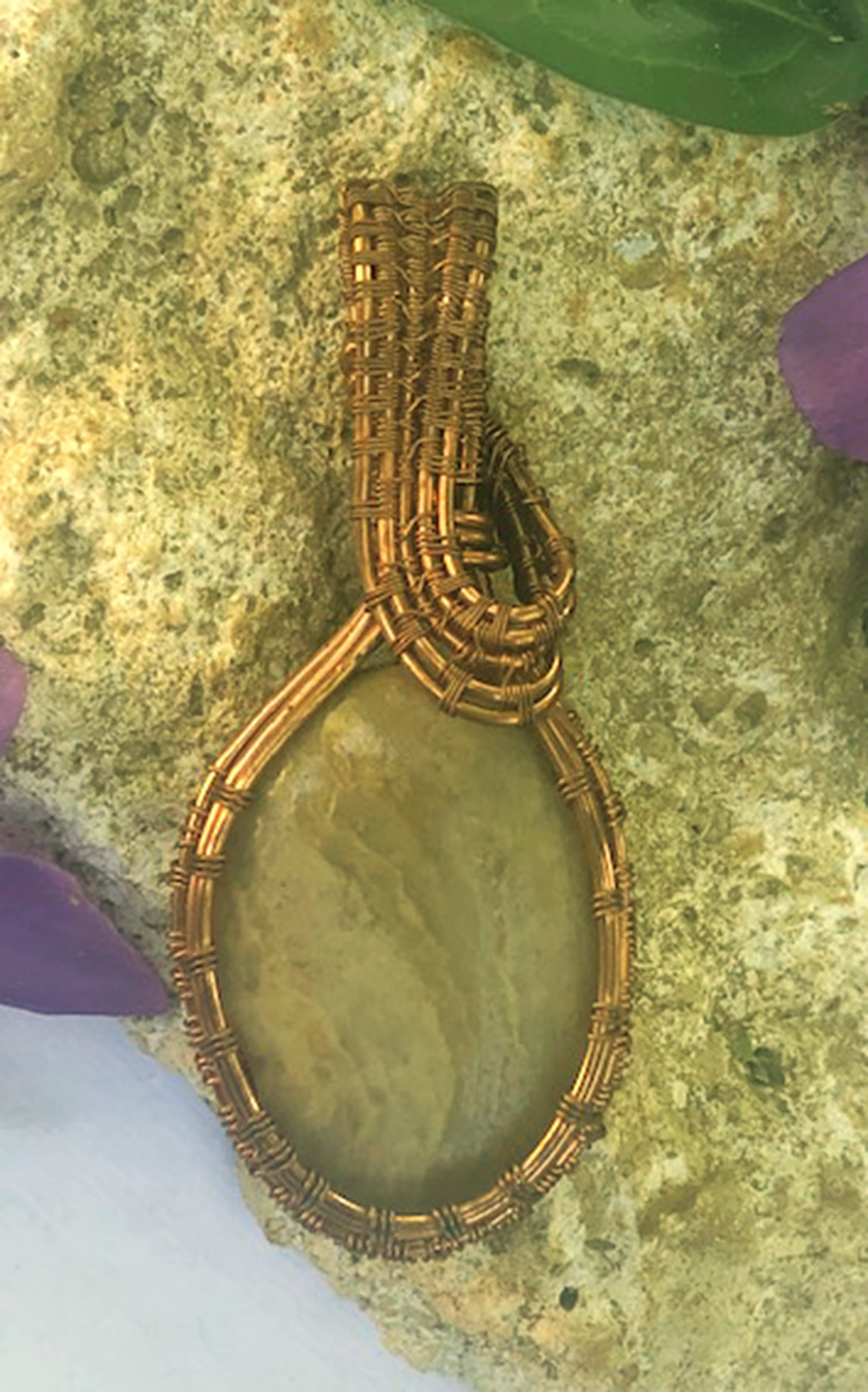 Beautiful wire wrapped Creek stone pendant